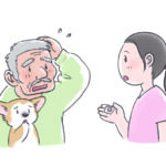 犬の飼い主さんに投薬について説明する看護師