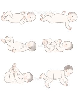 裸の乳児が仰向けで寝転んでいる