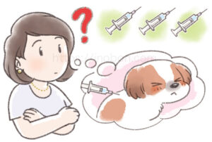 子犬のワクチン注射について考えている女性