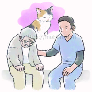 愛猫を亡くして悲しむ飼い主さんに寄り添う男性の動物看護師