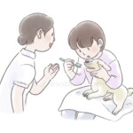 動物看護師が飼い主へ犬の歯みがき方法を伝えている