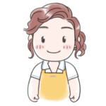 エプロンをつけた女性のショップスタッフ