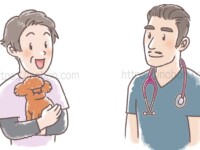中年の女性の飼い主と男性獣医師